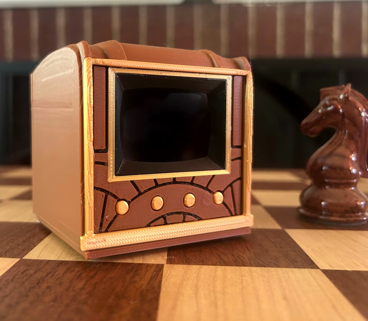 Three-quarter view of the Pict-O-Vision Still on a chess board